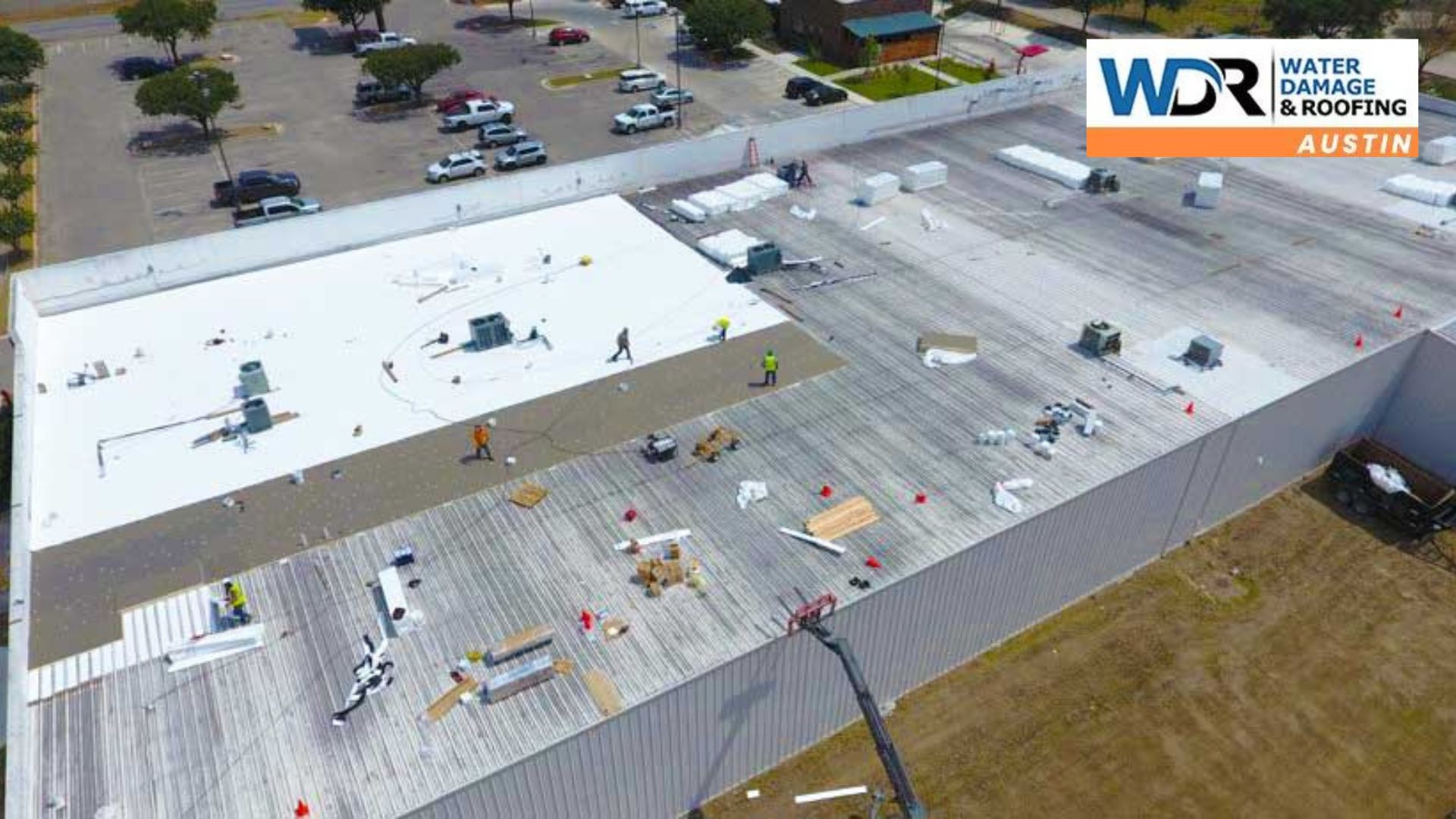 roofing crews on commercial flat roof 