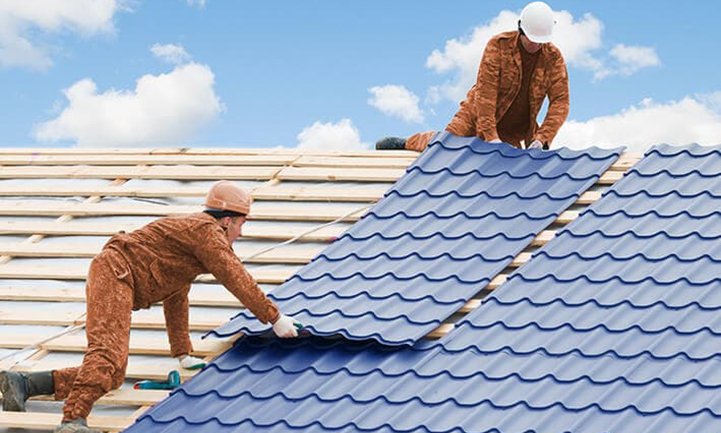 Roofers Working With Metal Tile