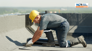 roofing contractor on flat roof